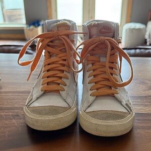 Gently used Nike high top blazers in orange and white